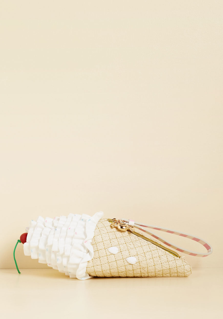 That sweet personality and delectable style sense of yours deserves nothing less than this ice cream cone clutch from Betsey Johnson! Topped with a cherry-inspired wood bead, sprinkled by 