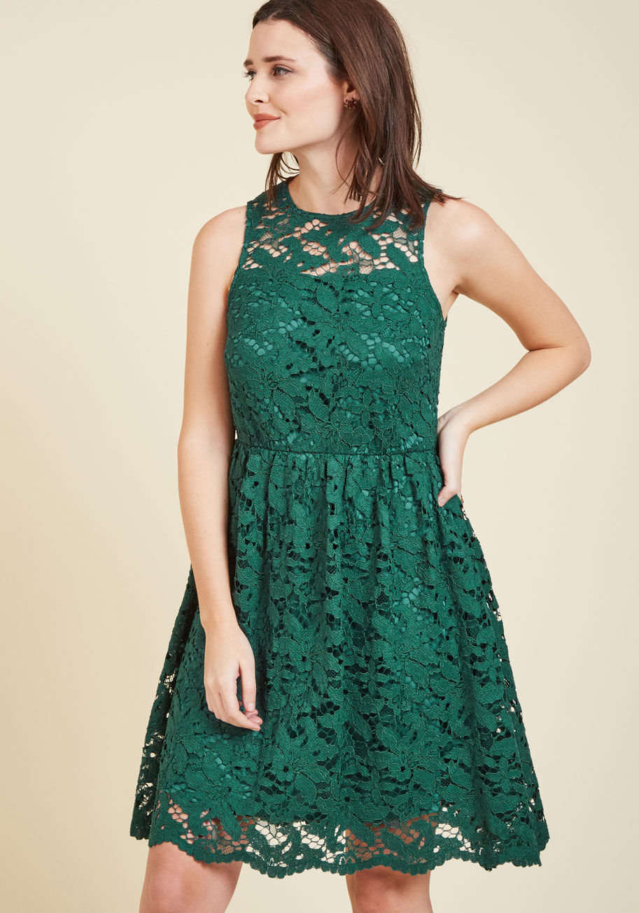  - The cheery mood you always adopt on a joyful occasions will only be amplified by the grace of this green dress from Wendy Bird! As you take a moment to exchange greetings and giggles with loved ones, guests admire the floral lace overlay and illusion neck