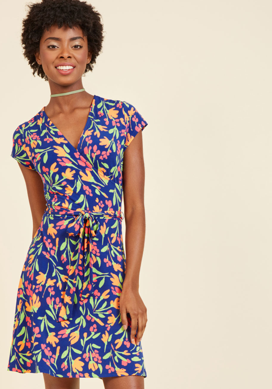  - The poster child of polish, the master of moxie - you've earned every title from flaunting this gingham dress! Fashioned into a wrap-inspired style, complete with a surplice neckline and waistline sash, and bursting with bright coral, magenta, and white h