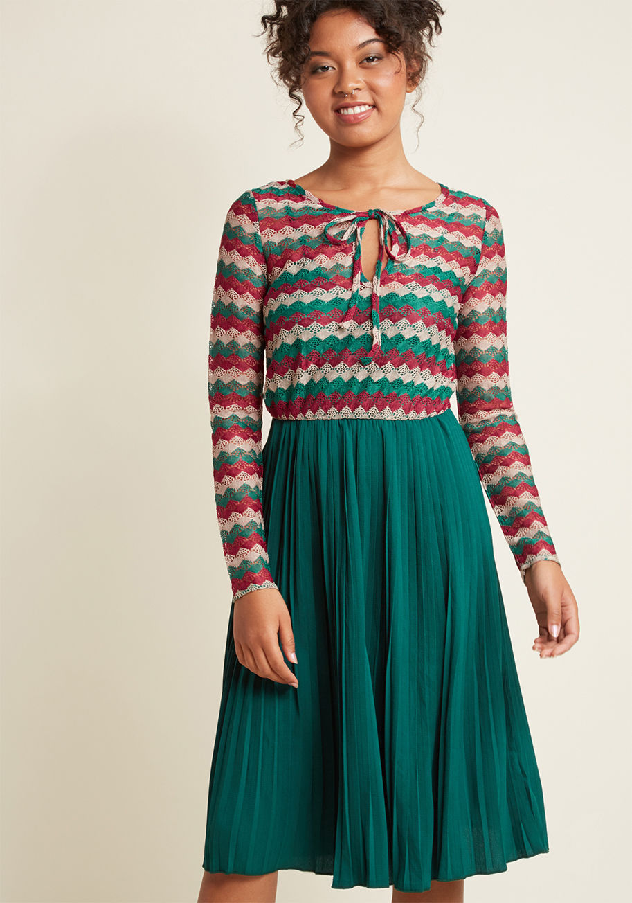  - There are endless ways to describe how we feel about this pleated midi dress, so for brevity's sake, we'll stick to its nomenclature compliment! A deep red, taupe, and green chevron motif enhances this frock's ornate, sheer knit, while its neckline tie, l