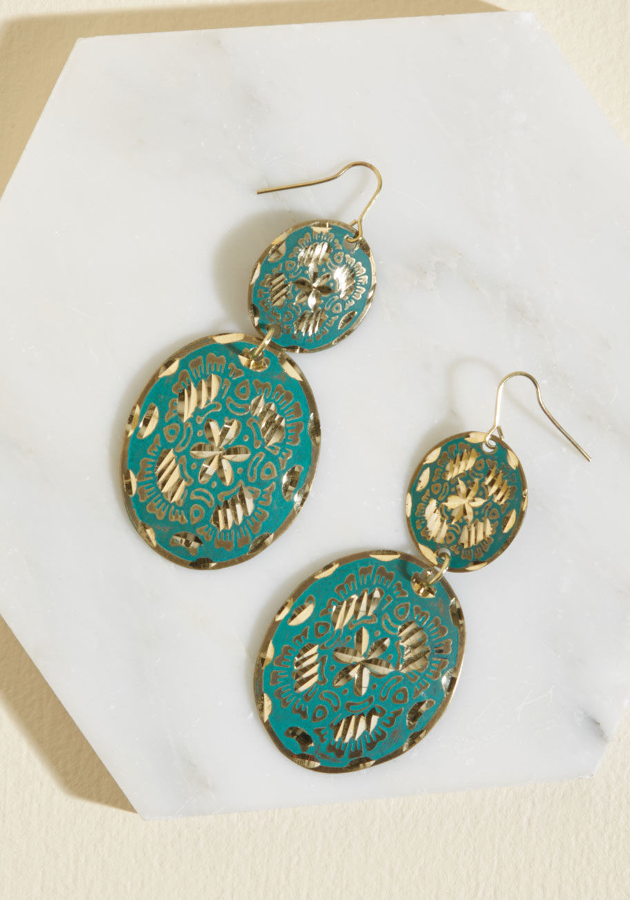 There's just something special about sporting these antiqued gold earrings! Featuring double discs that dangle beside your smile, a deep aqua hue, and shiny gold nicks, this pretty pair rocks a glimmer of glamour that you're proud to display. by 