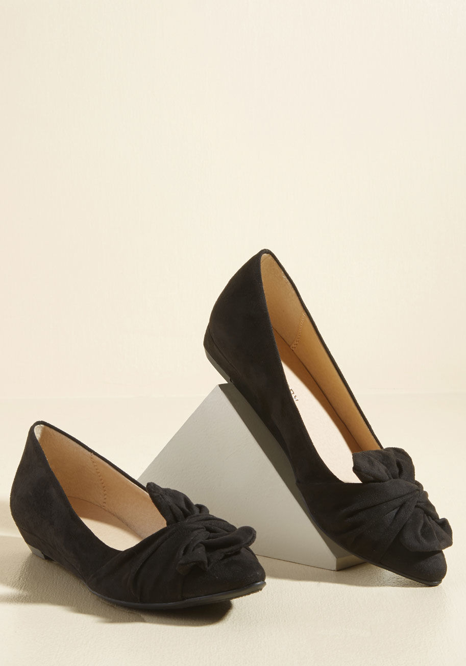  - These low, black wedges can transform a date night outfit as easily as they can complete an office ensemble! Touting pointed toes topped with twisted accents, these faux-suede kicks are versatile and vogue.