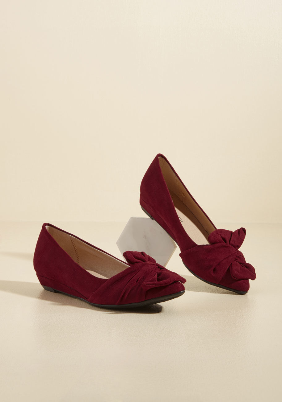  - These low, burgundy wedges can transform a date night outfit as easily as they can complete an office ensemble! Touting pointed toes topped with twisted accents, these faux-suede kicks are versatile and vogue.