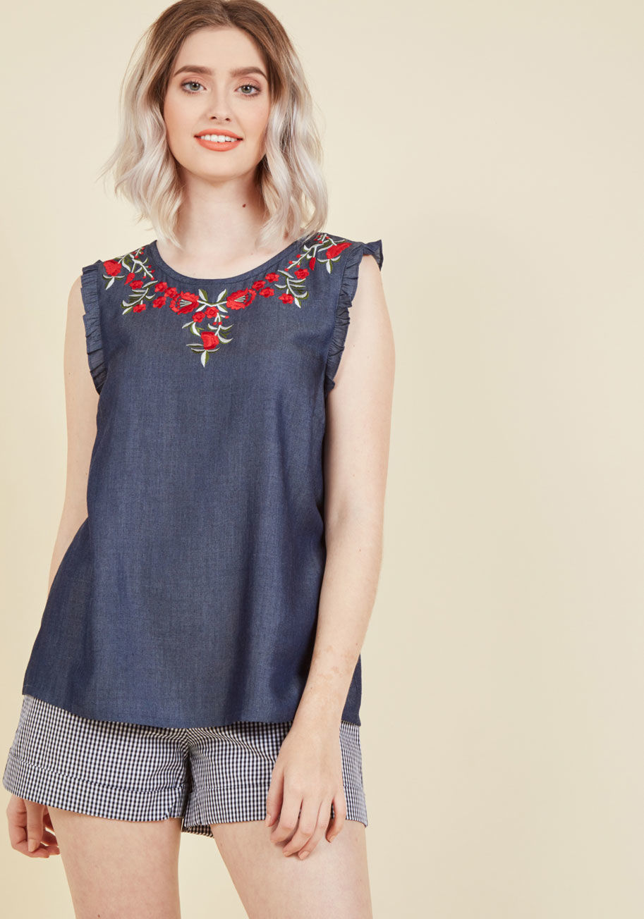  - This chambray top was made for flaunting is special touches with the greatest ease! A ModCloth-exclusive, this dark blue blouse leaves a lasting impression with its red, green, and white floral embroidery, ruffled shoulders, and charming back keyhole.
