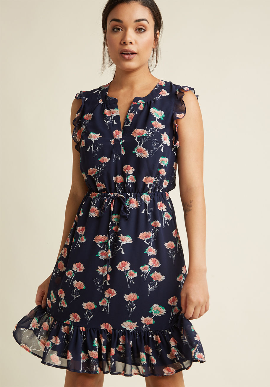  - This navy dress is simply divine! Feel free to doll up the ruffly shoulders and hem, V-neck, and drawstring waistline of this floral charmer with a few of your favorite accessories - or just let a gentle breeze serve as the method of accentuation for this