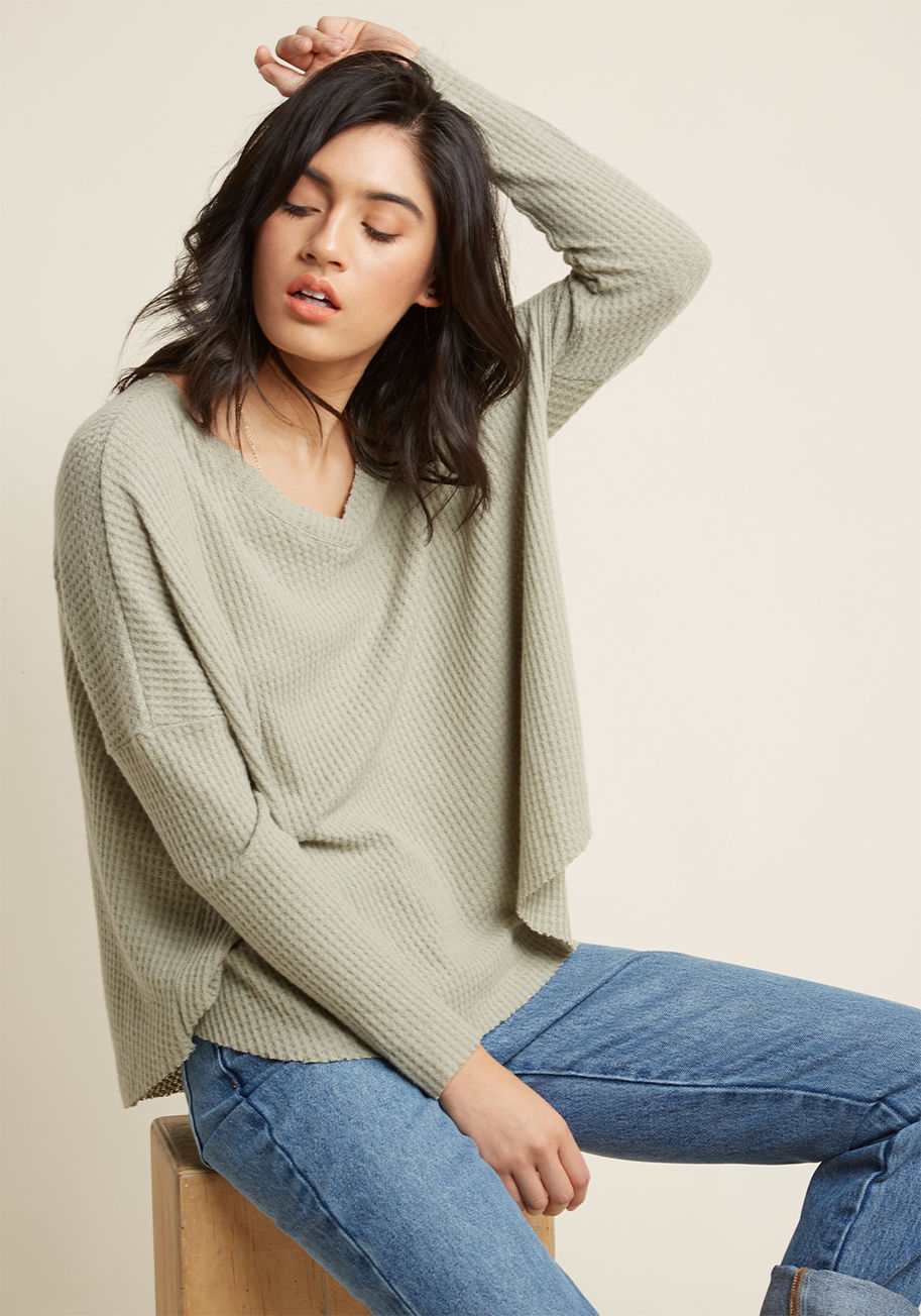  - This pale sage sweater is so superbly soft, it's guaranteed to become a piece you'll wear with frequency! Uncommonly cuddly from its V-neckline and drop shoulders down to its raw edges, this layering beauty easily earns its place