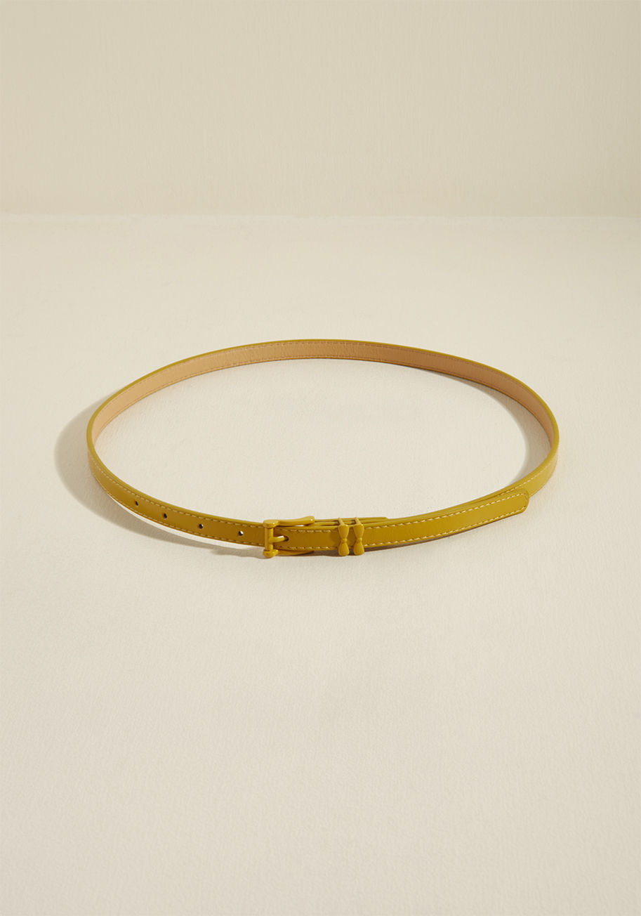  - This simple, slim belt by Banned has a way of taking ensembles from that'll do to holy wow! How so? Well, the rich red hue, matching buckle, and subtle double-bow loops of this faux-leather accessory are all thoughtful details that give your look a well-t