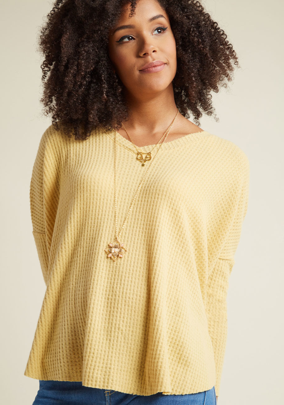  - This yellow sweater is so superbly soft, it's guaranteed to become a piece you'll wear with frequency! Uncommonly cuddly from its V-neckline and drop shoulders down to its raw edges, this layering beauty easily earns its place
