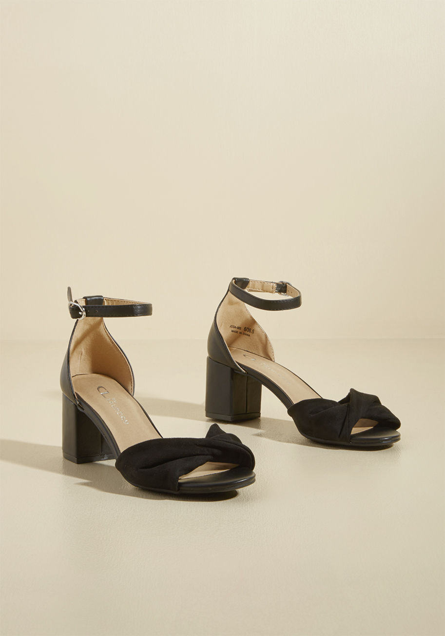 - Touting both wear-to-work sensibilities and cocktail hour appeal, these black block heels are versatile