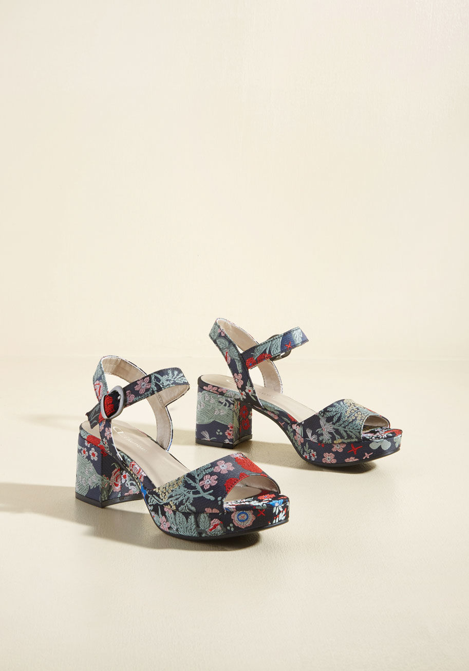  - We assert that it's impossible to resist flaunting these navy block heels all over every inch of town! The chic silhouette of these mid-height beauties is given a luxe lift through its brocade fabric, detailed