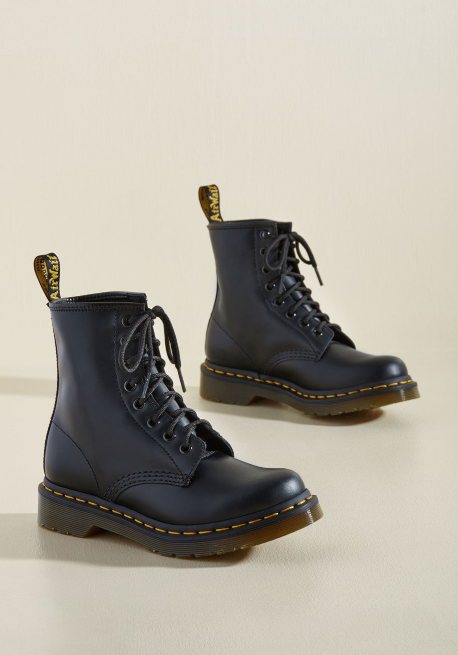  - When a righteous song comes on, and you&rsquo;re sporting your purple Dr. Martens boots, of course you want to bust out a sweet guitar solo! These rockstar-tough boots feature leather uppers, thick lug soles, and bold gold stitches. Worn with either their