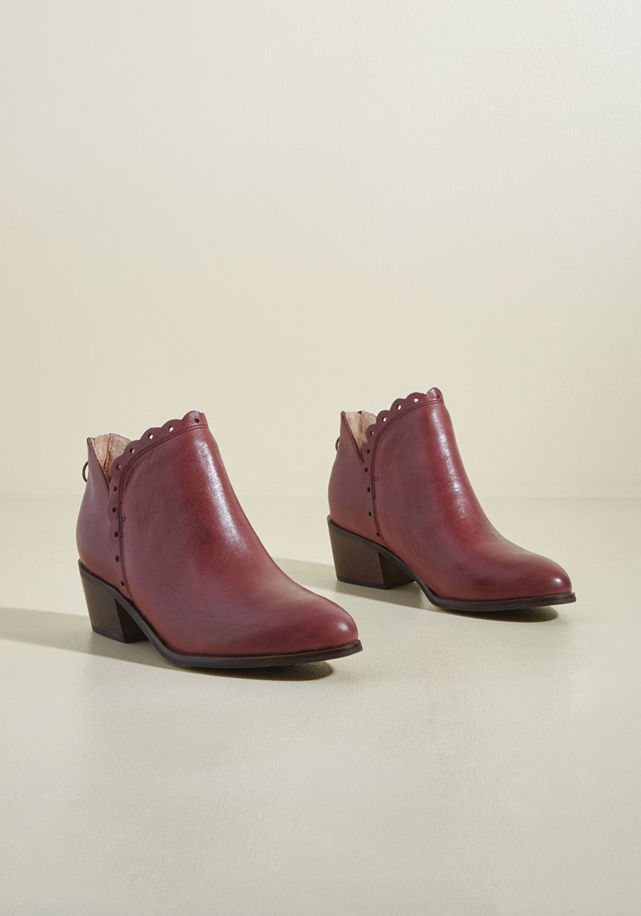  - When you test out a new style, your ensemble following tunes in. Imagine their delight the moment you debut these purple booties from Latigo! Supported by brown block heels and jazzed up with scalloped, eyelet edges