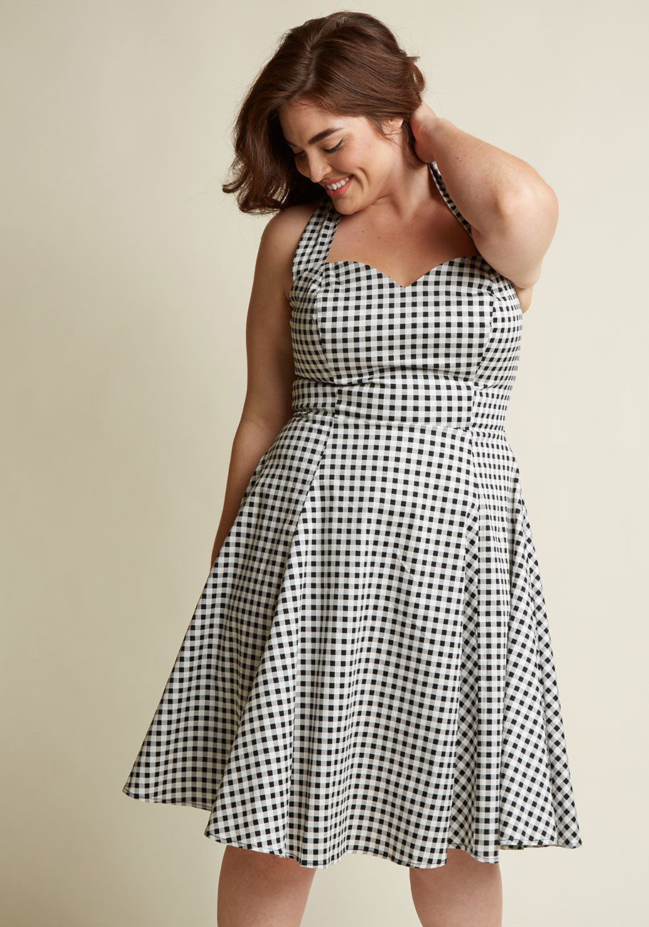  - With the territory of rocking this black-and-white gingham dress comes exuberant expressions of adoration from your besties! Take this stretch cotton frock out for a stroll to showcase its tied halter, sweetheart neckline, and circle skirt 'n' you may jus