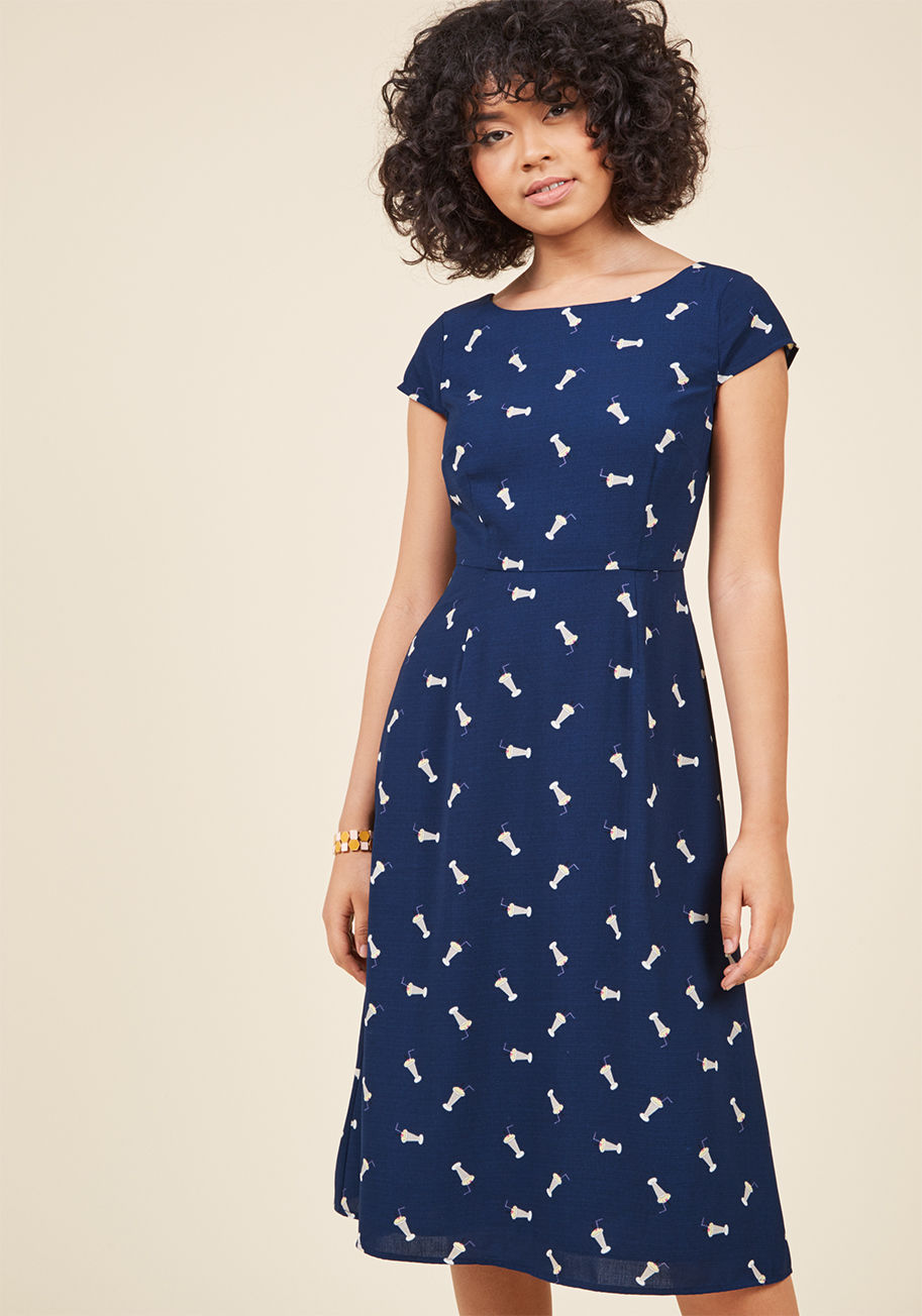  - Your flexibility and collaboration make you a valuable colleague, but it&rsquo;s this navy blue midi dress from Sugarhill Boutique that affirms your A+ style! Inspired by the founding siblings&rsquo; travels and spiffed up with a quirky milkshake print, t