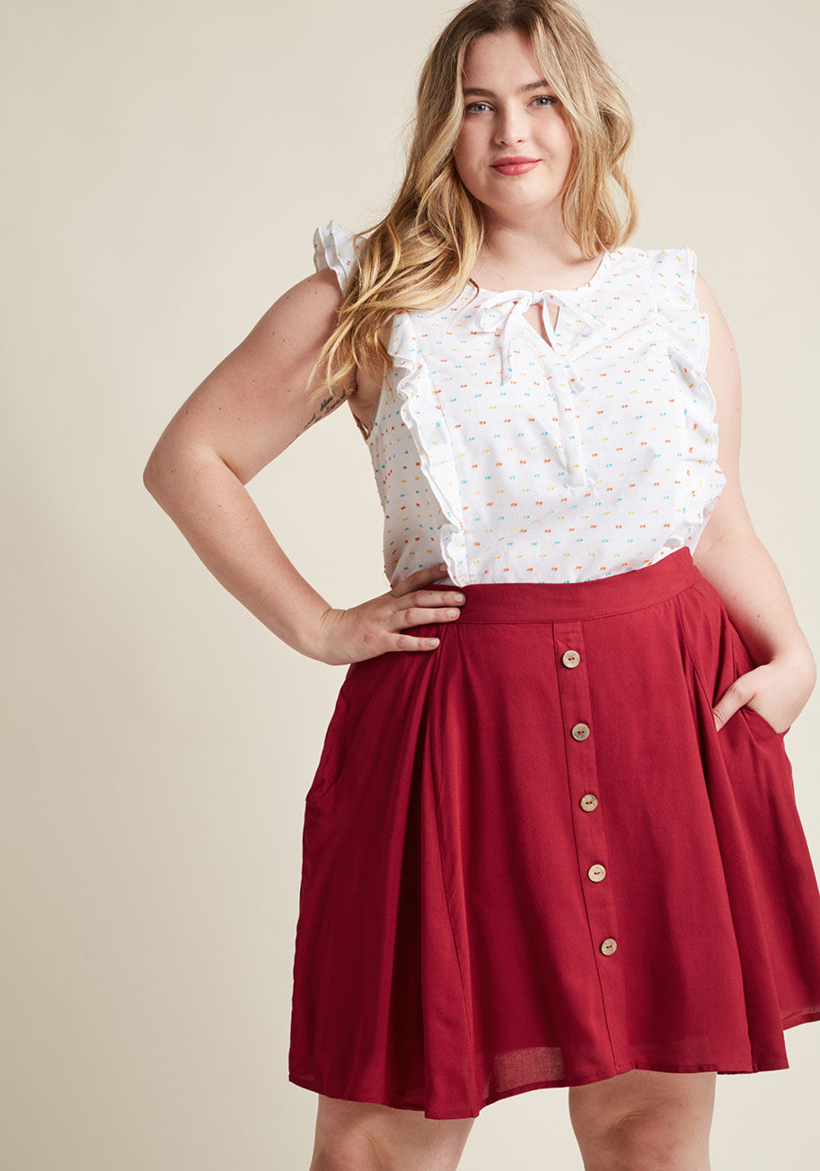  - Your kind of style involves all the bells and whistles, which is why this ivory tank top has a hold on you! Speckled with primary color clip dots, frilled up with shoulder ruffles, and fastened at the neckline with a tie and hidden buttons, this ModCloth 