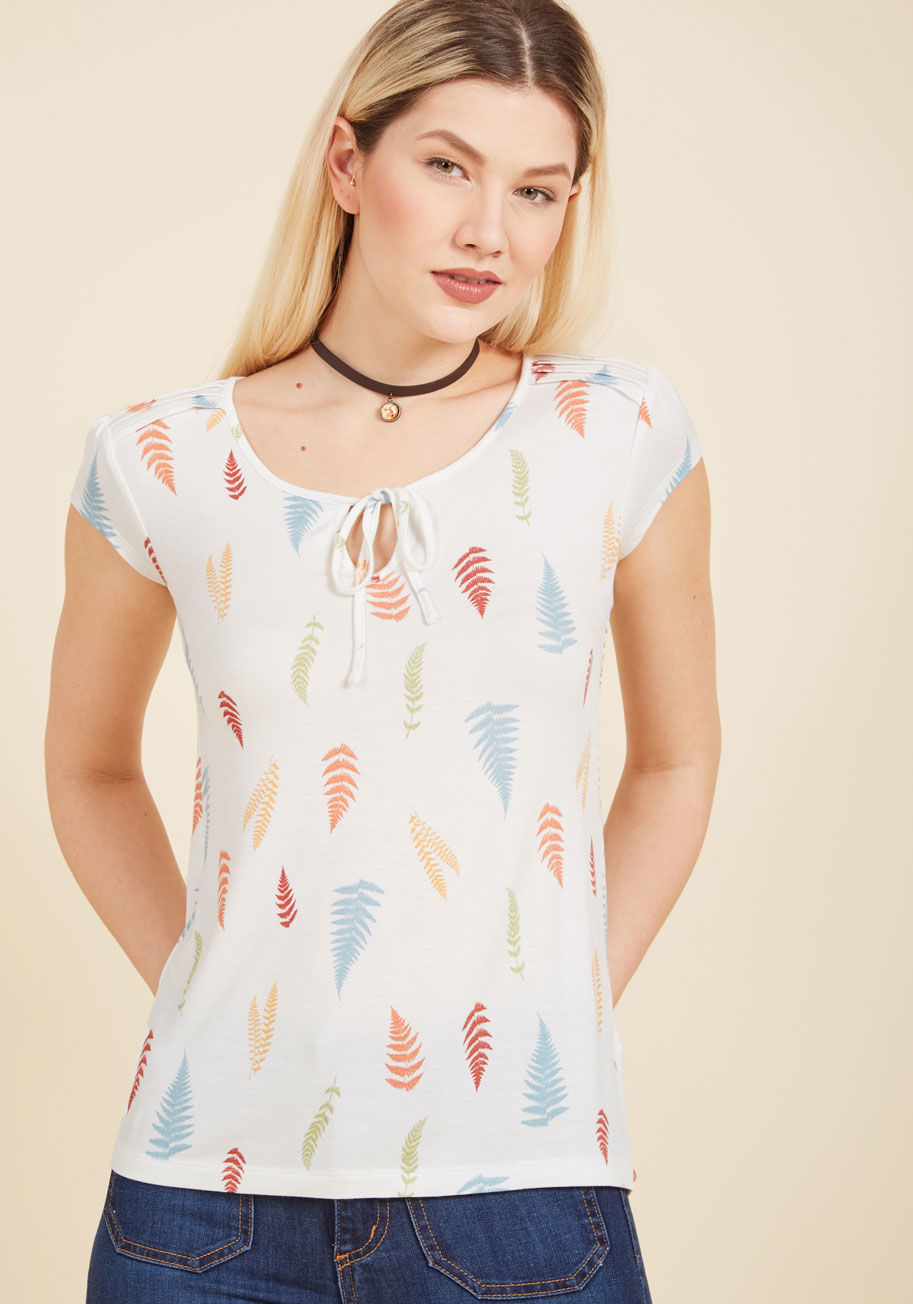  - Your wardrobe, like your garden, is given lots of thought and care, and this white top is proof! You're forever growing fonder of this delightfully soft knit shirt from our ModCloth namesake label, which employs pintucked shoulders, a tied neckline keyhol