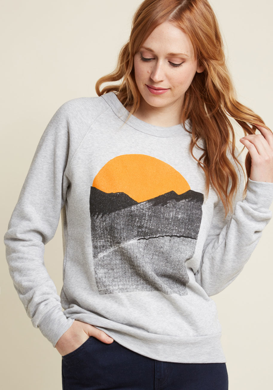 - You&rsquo;re not at home if you can&rsquo;t see a mountain, so when you travel, you always pack this ModCloth-exclusive sweatshirt by Kin Ship