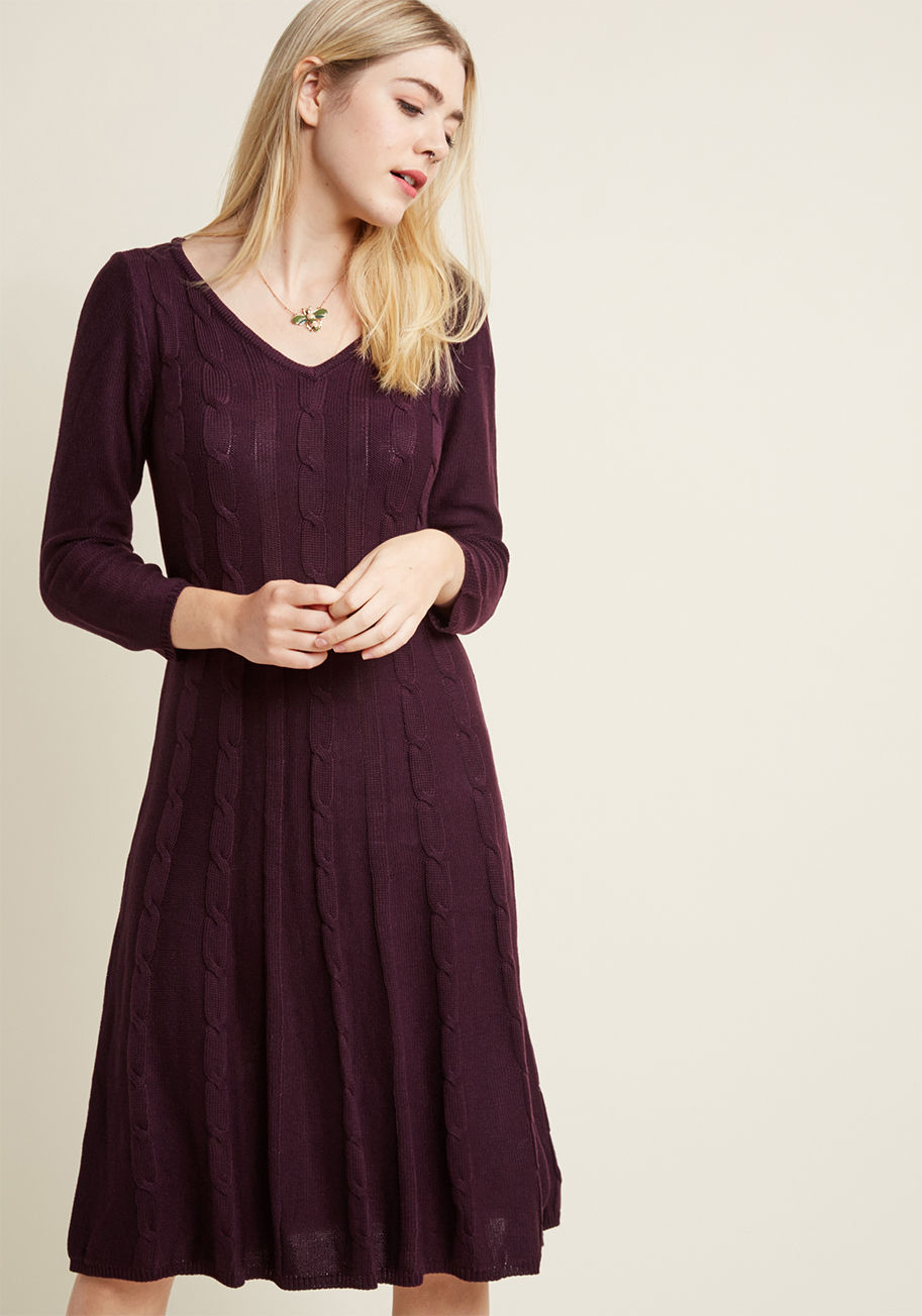 10656490 - By pairing up your sweet personality with the cozy allure of this dark purple sweater dress, your style audience will be sent into quite the swoon! In addition to its V-neck, long sleeves, and A-line cut, this warm midi is textured with classic braided ca