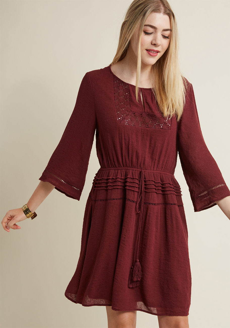 Browsing produce booths has never looked nor felt as beautiful as it does while donning this bell-sleeved dress! Flavored with boho-inspired touches like a crocheted yoke-framed keyhole, a tasseled tie-topped waistband, and a pintucked skirt, this crepey  by 24104D