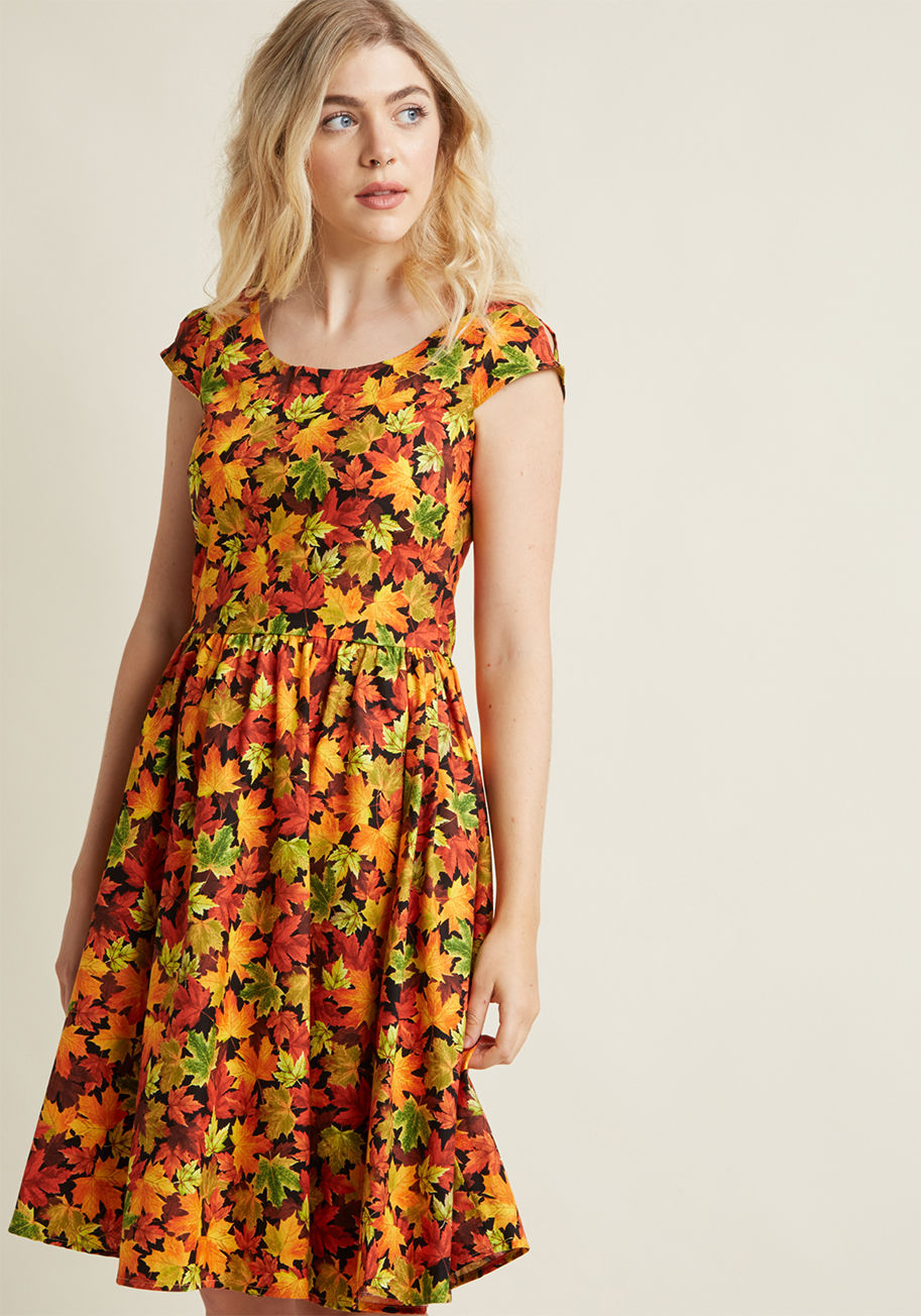 You declare your love for all things autumnal by wearing this patterned dress to your town&rsquo;s fall celebration! As you enjoy a caramel apple and visit craft vendors, fellow festival-goers admire the orange, red, gold, and black maple leaf pattern and by 3501