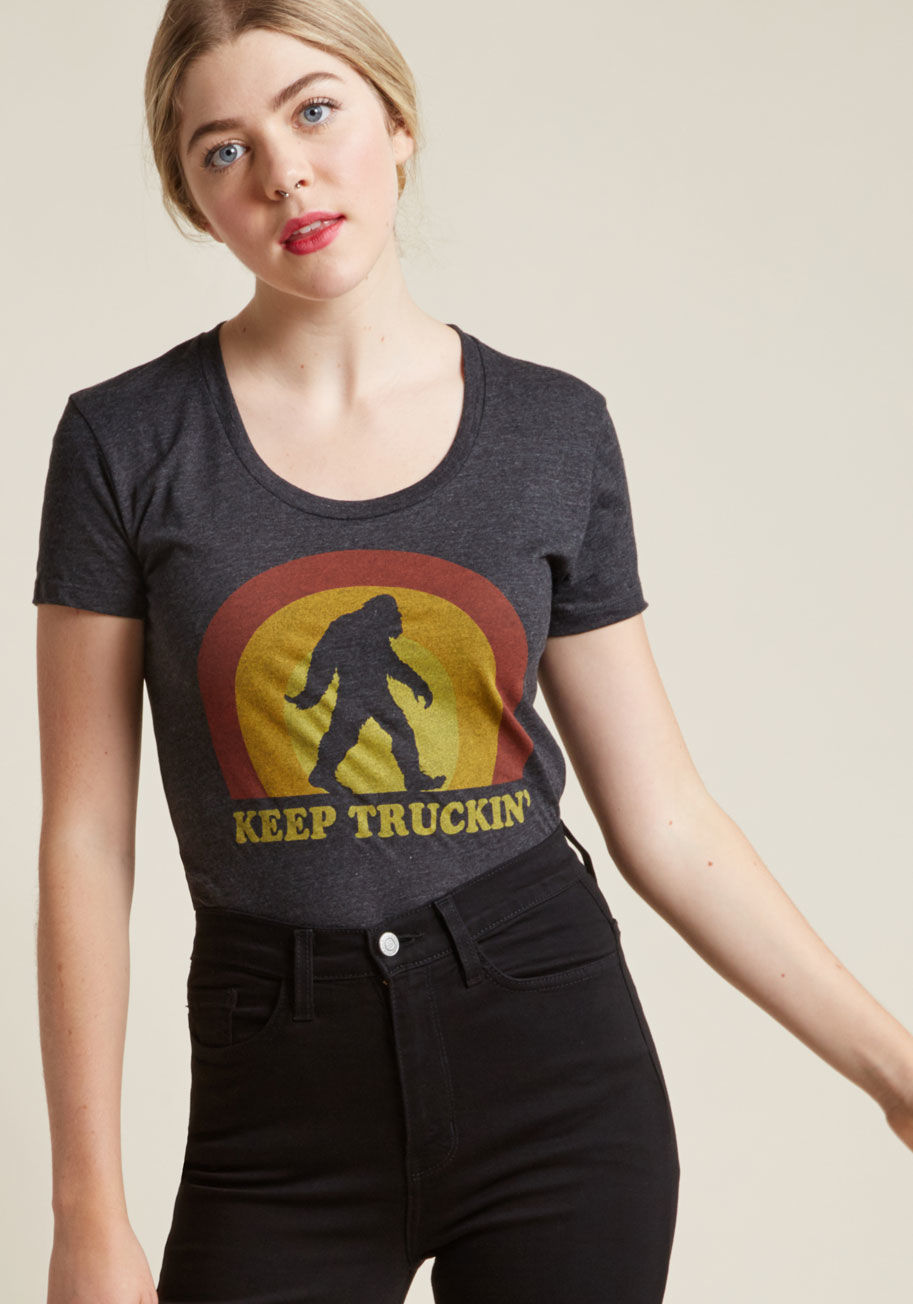 4127W - On its own, this grey graphic tee is quite the fun fashion find. But, combining the warm-toned Bigfoot graphic of this scoop-neck piece with your pre-existing pieces to create a quirky-cool outfit? Now that's the 'tops'!