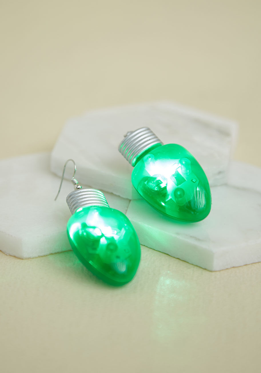 How holiday-happy can you get? These light-up earrings prove you're down to go all in! Delightfully green and silver, with a matching button behind each bulb to make them flash with LED fabulousness, this statement-making pair arranges for a jolly style e by 80955-GN