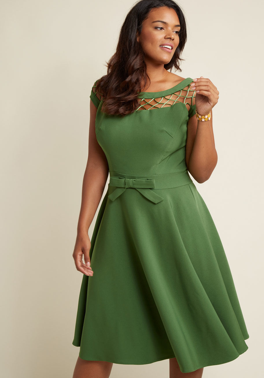 ALIKA - You pride yourself upon being a lady of style and sophistication. Still, you find that you simply can't resist adding a sly wink of whimsy and sultry allure to your wardrobe - a fact beautifully showcased by this green dress by Tatyana. The classic shape 