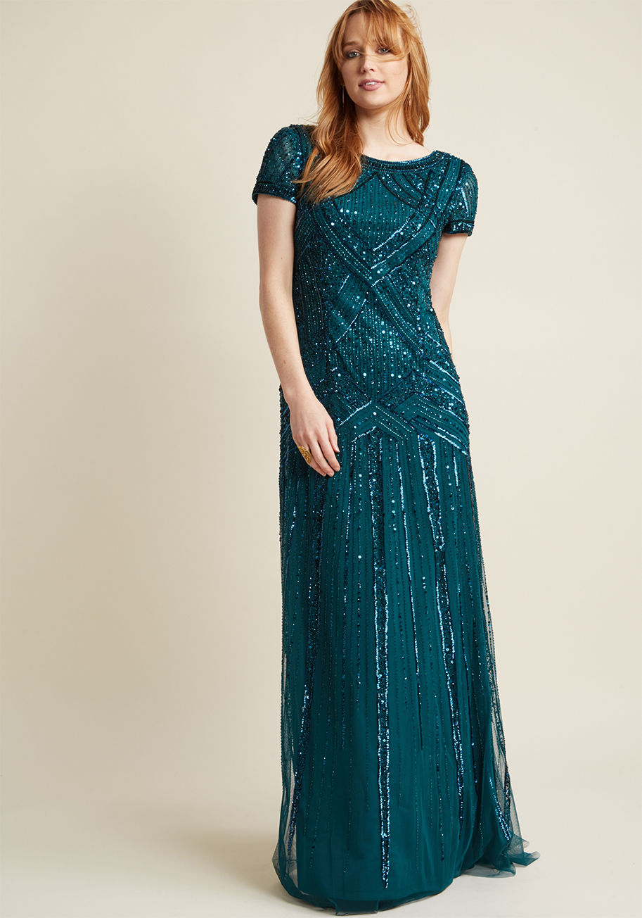 Turns out the gown you had imagined for your upcoming formal event is real and it's this radiant teal maxi dress by Adrianna Papell! Designed with a graceful scoop back, sweet cap sleeves, and '20s-inspired sequining delicately dazzling its entire silhoue by AP1E200563