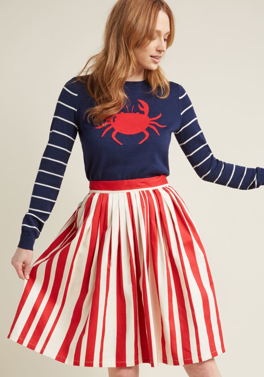 B7083B - If ever there were a skirt worth teaming up with basics, it'd be this pocketed A-line from our ModCloth namesake label. Making itself known with red-and-ivory vertical stripes, pleating at the waistline, and a canvas-like construction, this sturdy, statem