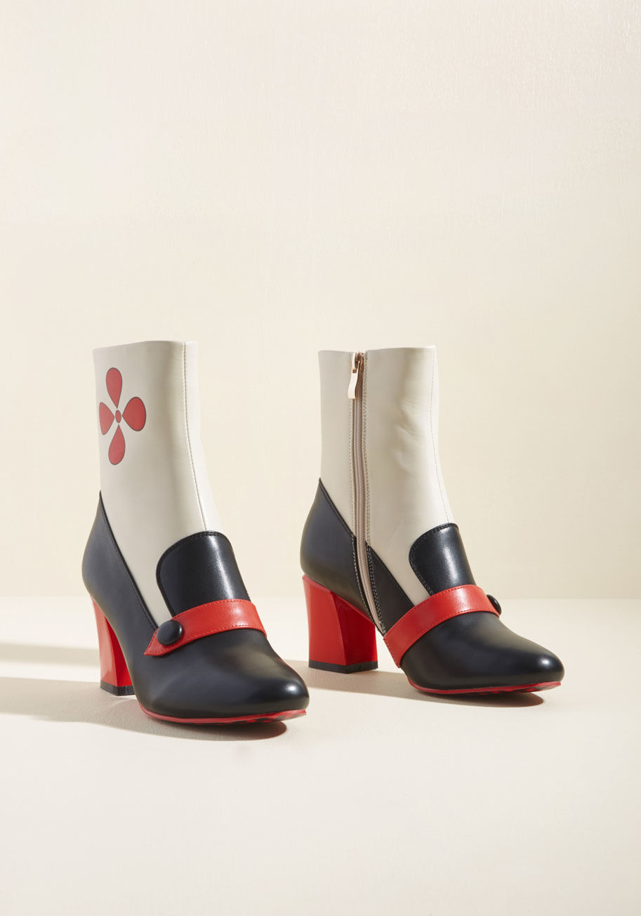 Bnd-252 - Are they loafers? Booties? Heels? We'll tell you what this Banned pair is once and for all - marvelous! Inspired by the swingin' sixties, these faux-leather kicks will have heads turning left and right to check out their ivory shafts, red droplets, black 