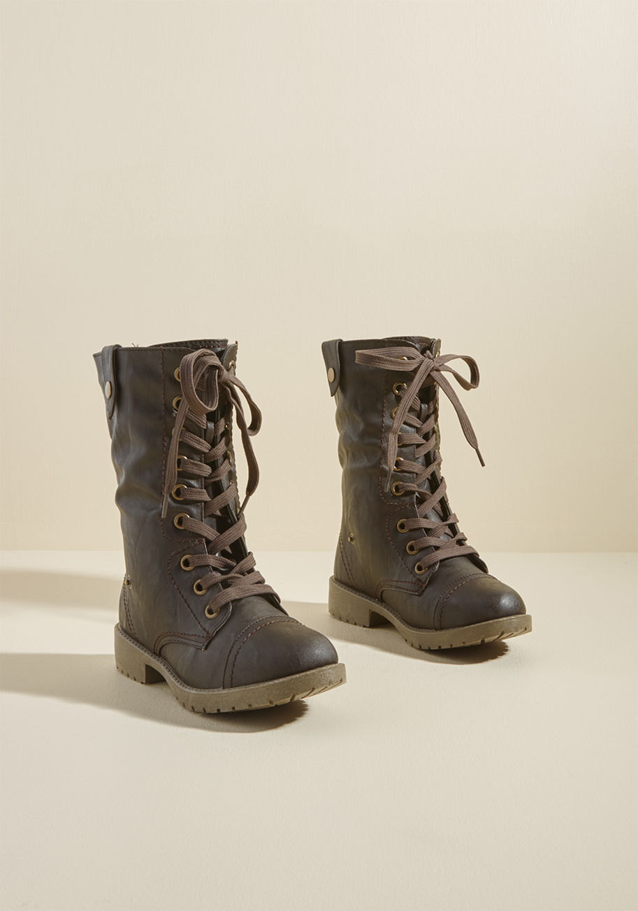 Colorado - If adventure is on the agenda, you excitedly oblige with these brown boots! Perfect for days spent outdoors with their sturdy laces, treaded bottoms, convenient back zippers, and classic aesthetic, this faux-leather pair goes where you do - and that makes