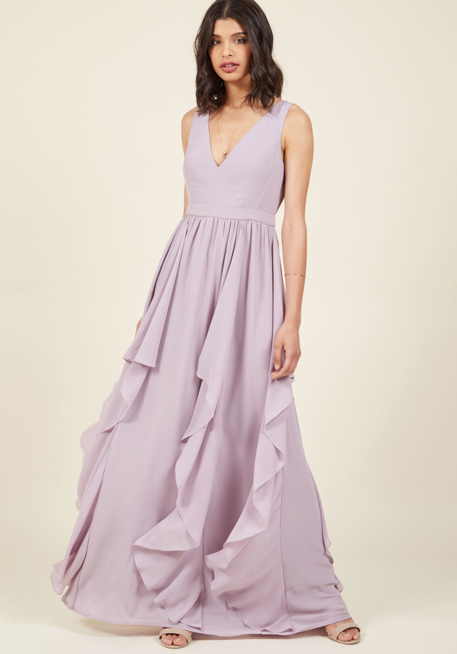 D-61568 - With each ebb, the gorgeously draping ruffles dancing down this pastel purple maxi dress make a new bystander fall