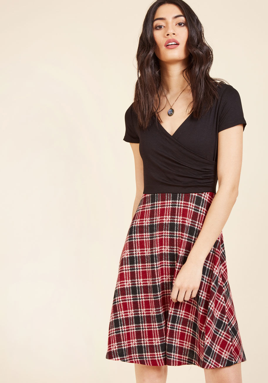 D7453-8 - Whether you decide on blueberry oatmeal or waffles at the botanical garden&rsquo;s cafe, you already made a stylish choice by donning this twofer dress. Boasting a flirty, black wrap top with softly gathered details and a red plaid skirt