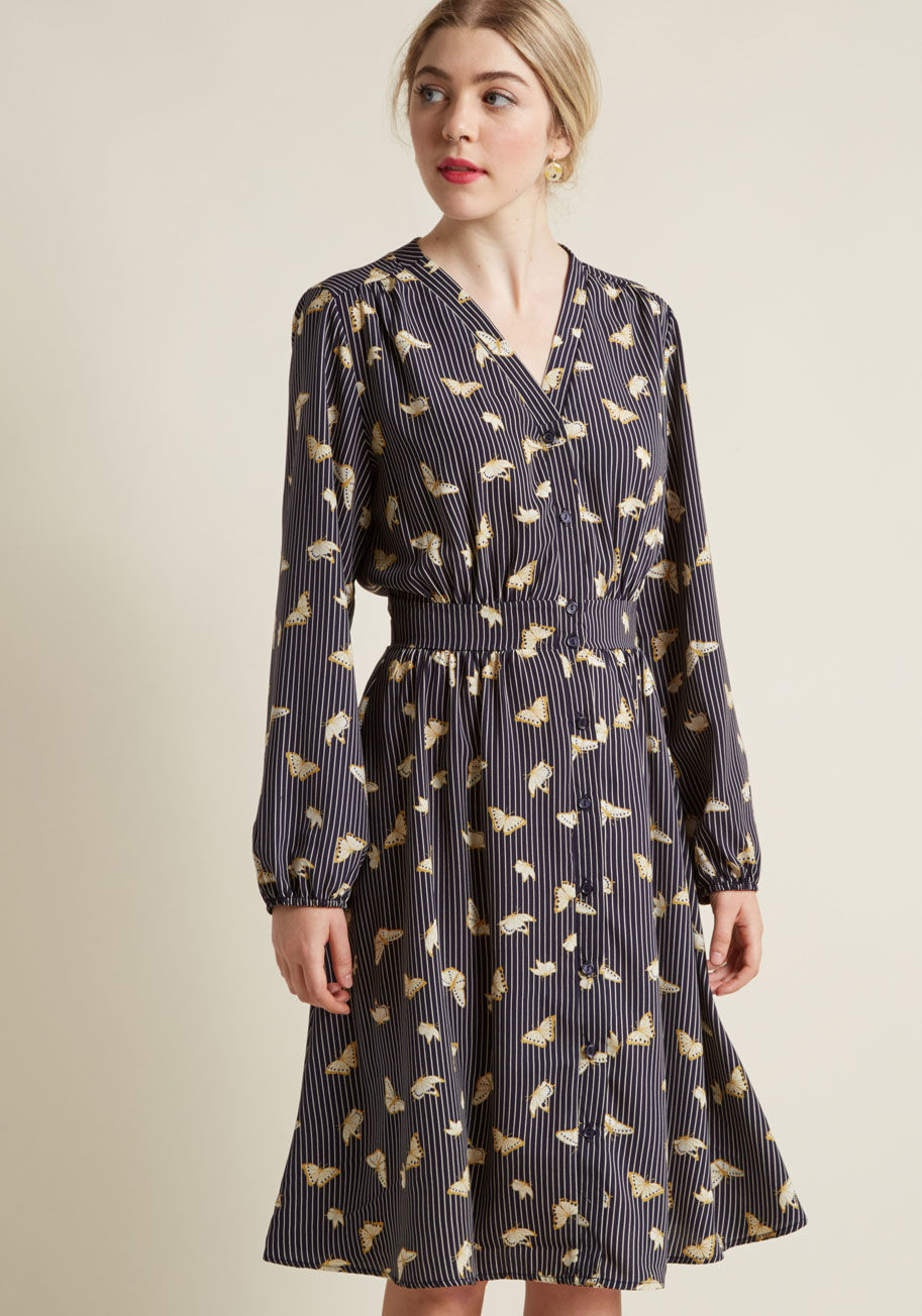 Once you discover this navy shirt dress performs perfectly at the office and beyond, you'll be quick to promote it to your workwear rotation! A ModCloth exclusive, this collarless frock touts light gathering at the shoulders and waist, elasticized cuffs,  by D905-01