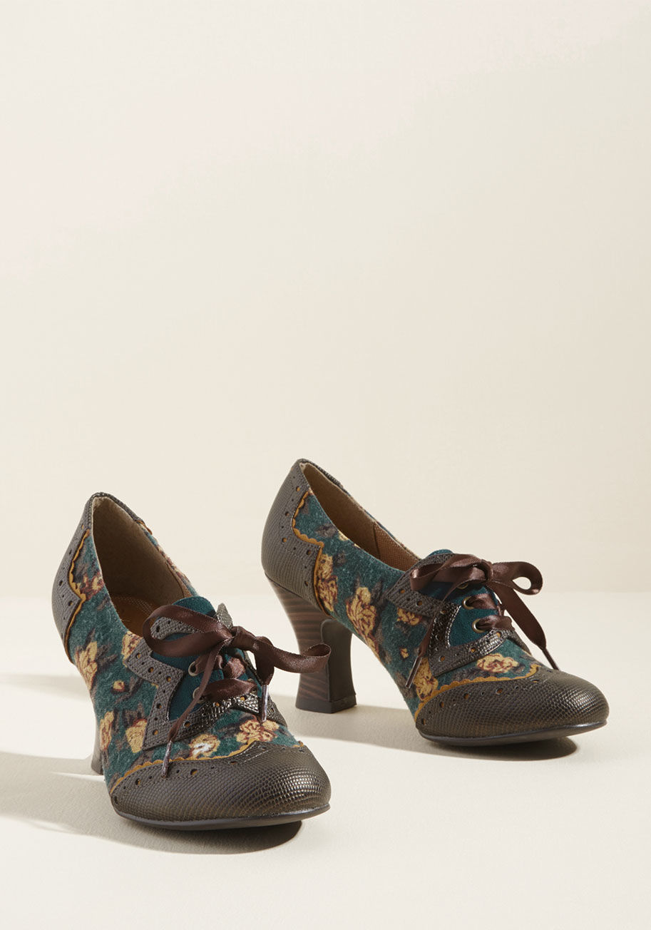 Daisy - Happy trails to you and these teal heels on your next antique shop tour! As you peruse glassware and records, other shoppers are sure to notice the ribbon laces, textured faux-leather toes and counters, and stacked heels, making this dazzling bronze-touch