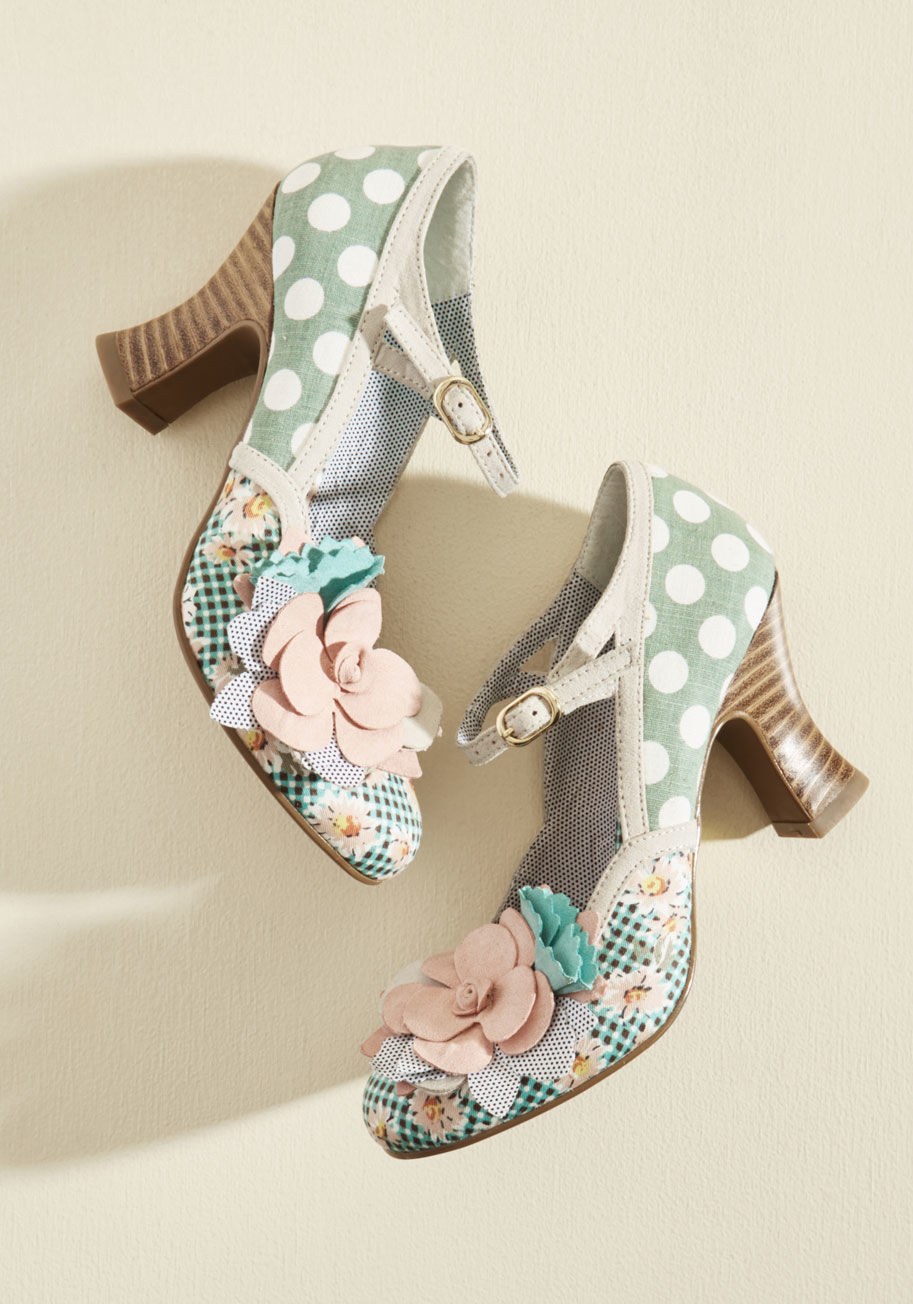 Dee - Match these rosette-accented heels up with a memorable ensemble and get to mingling tout suite! Standing atop tapered, faux-suede heels, secured by straps, and showcasing a union of dotted and geometric fabrics flaunting slate blue, white, and tan hues, t