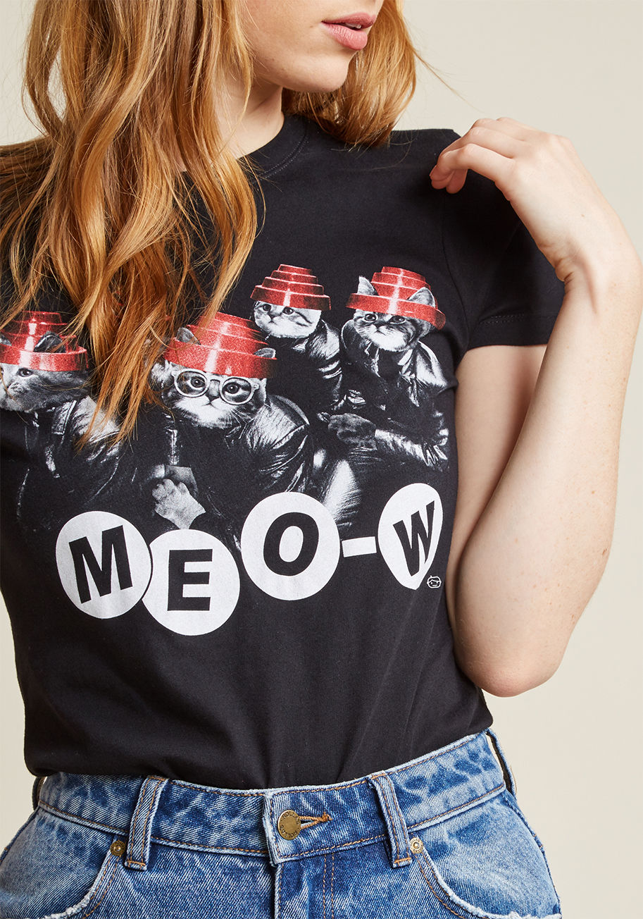 DEV0062-502BLK - Any Devo fan is a friend of ours! This black band tee brings the quirk of these classic rockers alive by way of its kitten spin. One thing's for sure - any wearer of this short-sleeved top is one to 'whisker' it good!