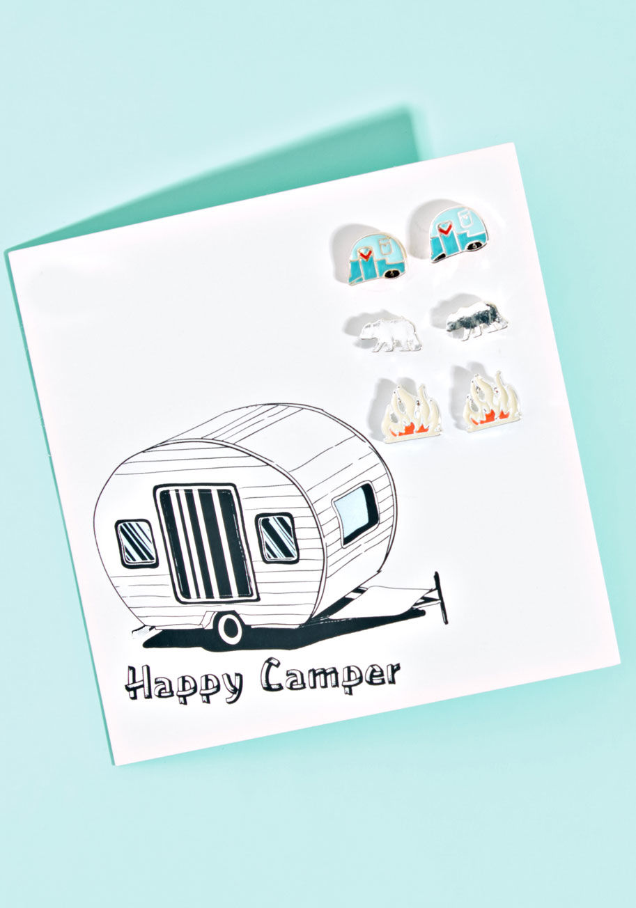 Whenever you hear the call of the forest, respond with a show of these stud earrings. Campers, bears, and crackling fires - replete with surgical steel posts and colorful enamel coating - make up this wild collection, and bring the feeling of fresh air wi by E5421
