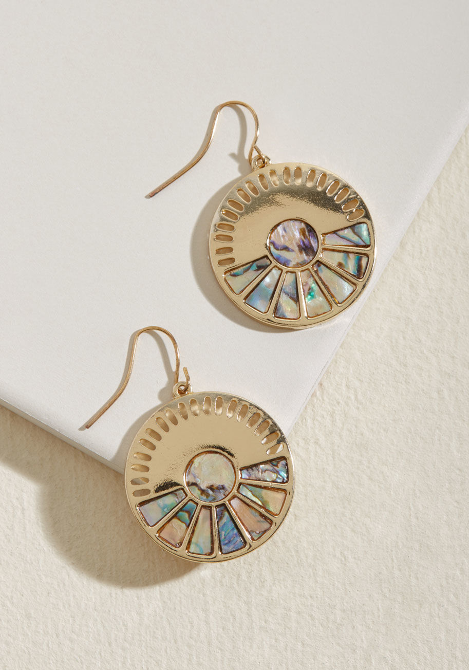 Once you lay eyes on these golden earrings, your outlook on accessories will be broadened! Each dangling disc flaunts a series of cutout notches and a fanning out of mother-of-pearl-inspired inlays, offering a vibe both beachy and blissfully retro. by EA66642