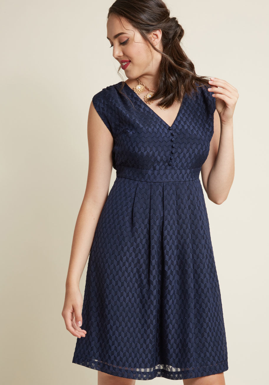 FA17MCD1386 - If you're not in-the-know on why vintage-inspired styles are so sought after, then get acquainted with this navy blue dress! All it takes is one spin