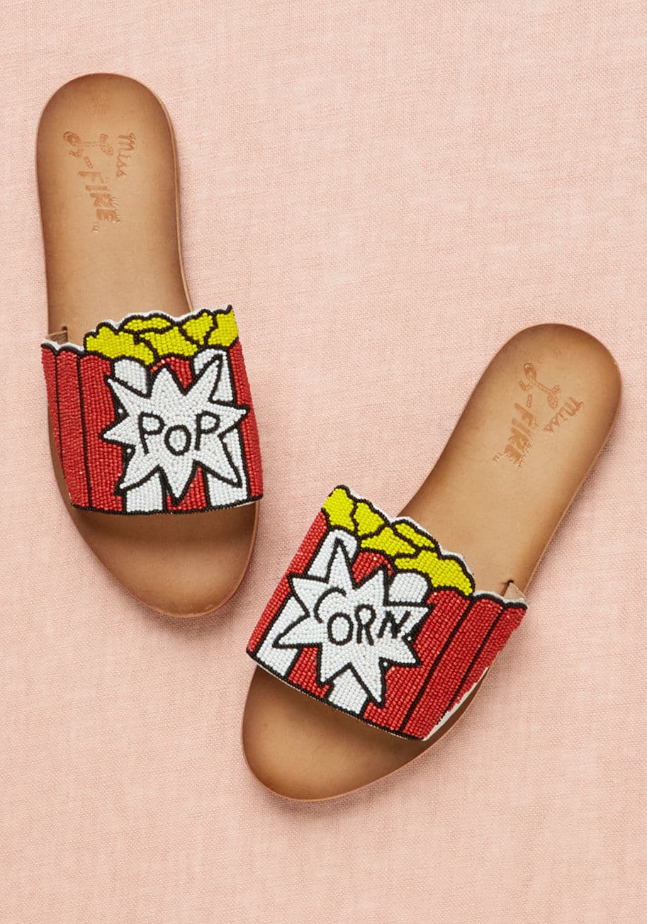 Front Row - Set yourself on track for a day of flaunting your foodie identity by slipping into these slide sandals from Miss L Fire. Each toe band touts a beaded bag of popcorn, fulfilling your fantasy of living out a stylishly snack-filled day!