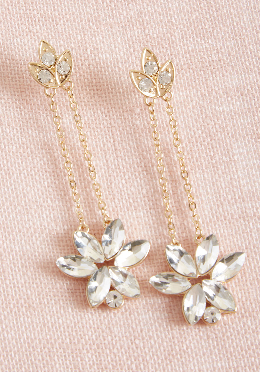 IE4925GDCRY - When the invitation implies fancy dress, you're ready to rock these radiantly retro earrings! Designed with golden leaves at their posts and a duo of chains supporting each rhinestone flower pendant, this pretty pair is perfectly impressive.