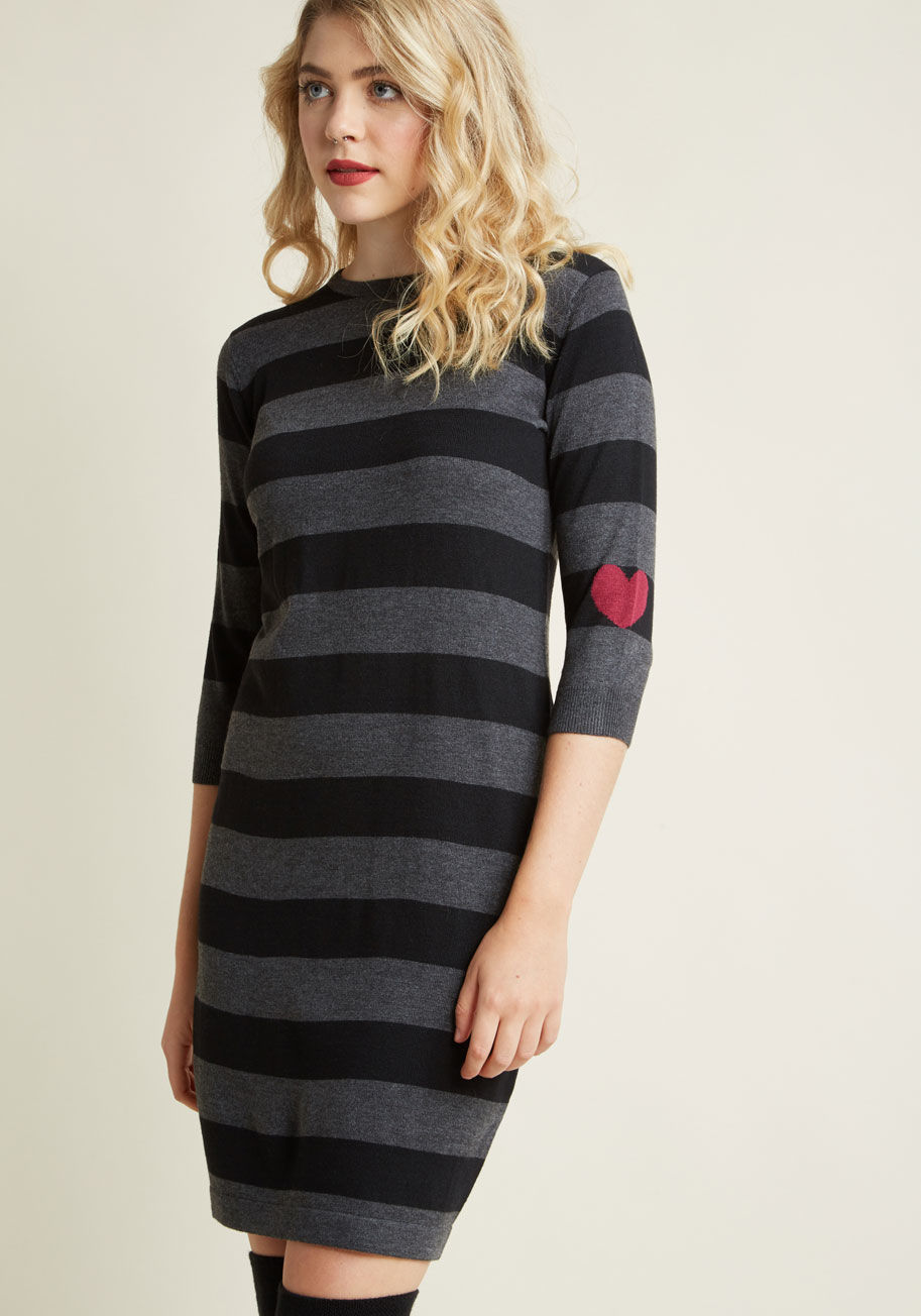 The frock before you is more than just a striped sweater dress - it's a truly unique treasure! From Sugarhill Boutique, this black and grey sheath is made special with a crew neckline and a single magenta intarsia heart atop one of its cropped sleeves for by K0036