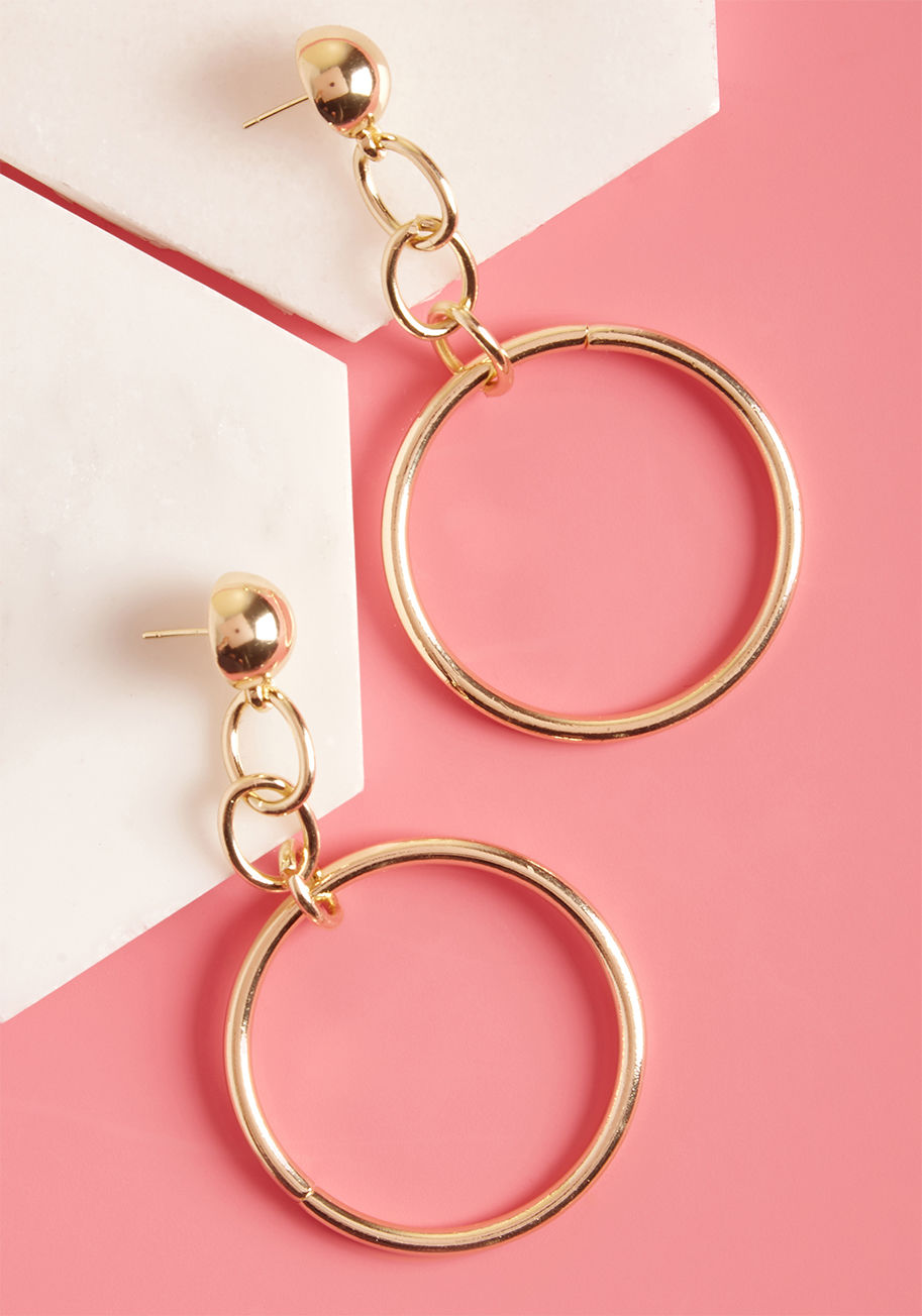 These gold hoop earrings are your badge of panache! Secured into place with ball posts, these dazzling danglies feature bold cable chains and radiant rings that revitalize your marvelous look with retro flair. by KE6787G