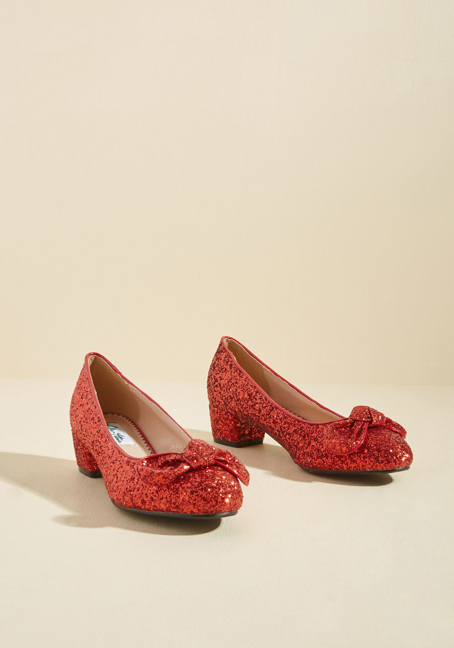 LH104 - Whether you're paying homage to a cherished book-turned-film or creating a tale of your own, these red block heels are just the kicks for the job! Fashioned into a comfortable midi height, topped with a bow at each toe, and covered