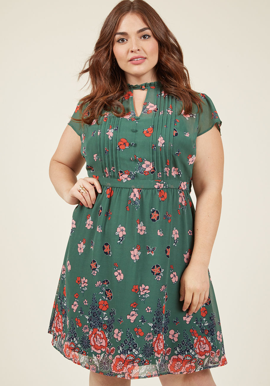 MCD1076C - By the light of dawn, you don this floral dress and depart for your artistic internship. As you drift amid the galleries, the buttoned neckline, pintucked bodice, and navy, orange, and pink flowers of this gorgeous green ensemble - part of our ModCloth na