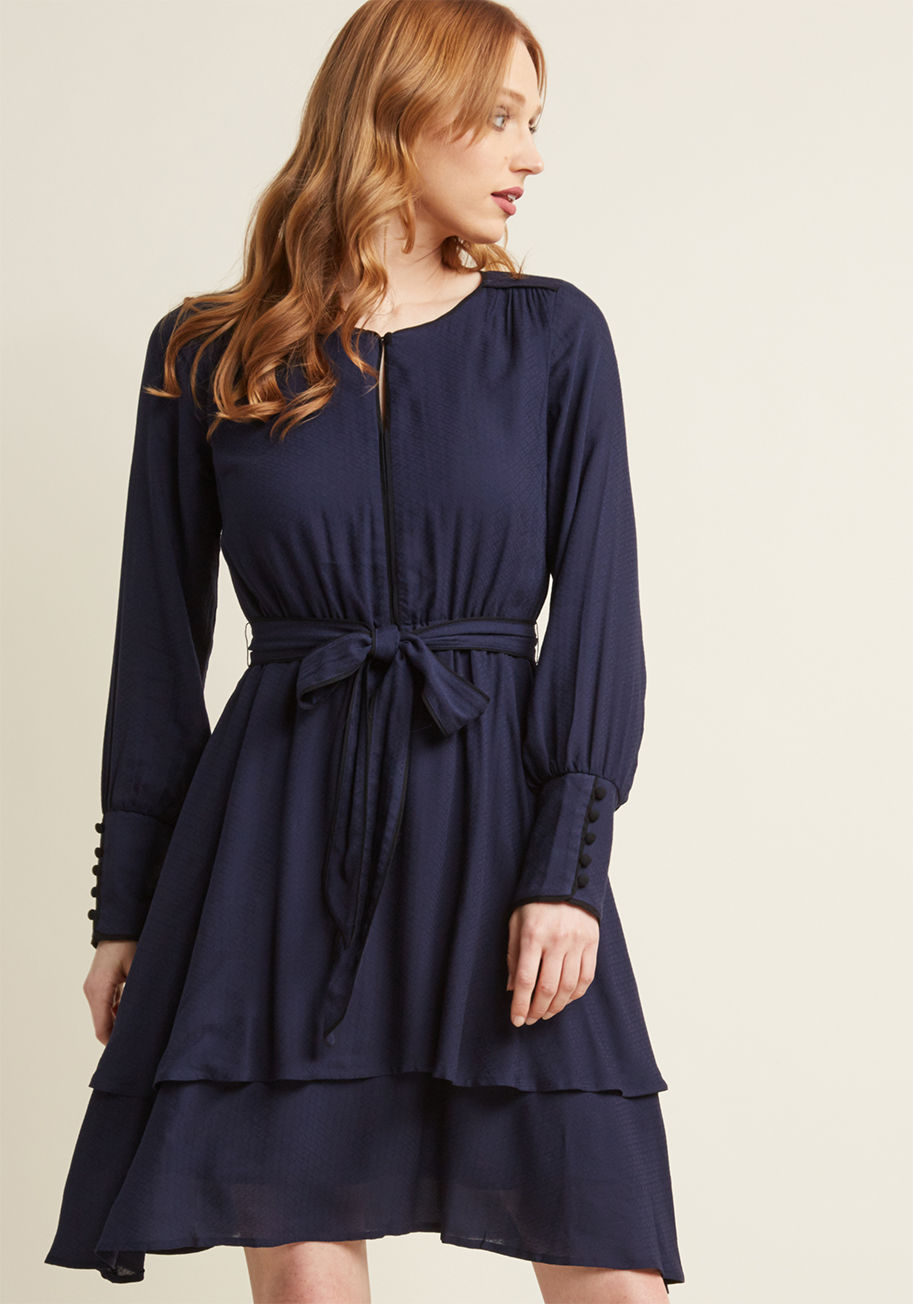 As dashing as it is demure, this long sleeve dress is an above-ordinary look! Part of our ModCloth namesake label, this navy blue frock features a textured woven material, buttons down its statement cuffs, and a two tiers to its skirt. What's more, brilli by MCD1428
