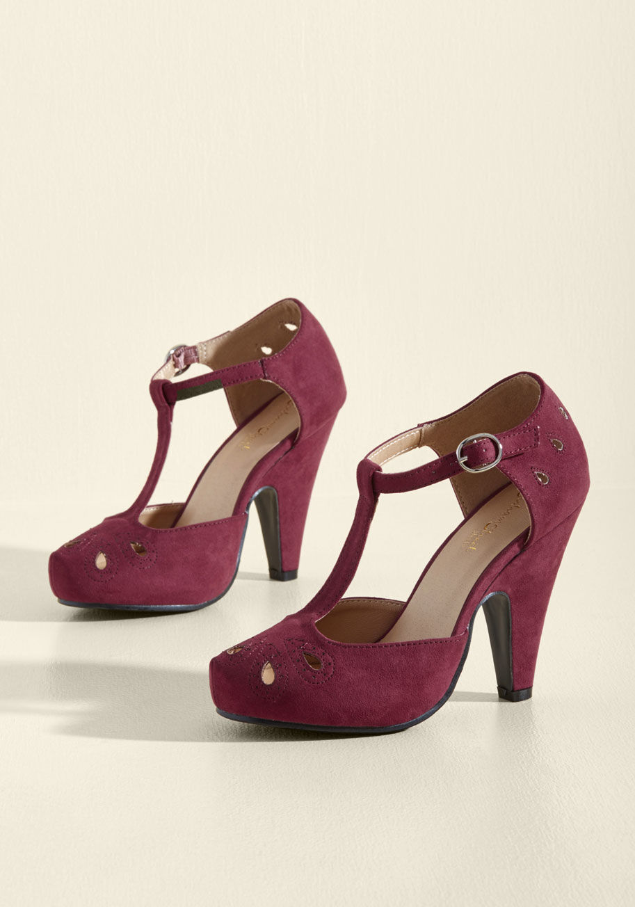 MCDD 1-2W - Team these playful burgundy T-straps up with your dynamic dance moves and watch as magic unfolds! The tapered heels, teardrop-shaped cutouts with perforated accents, and faux-suede finish of this ModCloth-exclusive pair all put an oomph into your outfit t