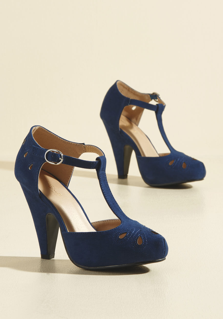 MCDD 1-3W - Team these playful navy T-straps up with your dynamic dance moves and watch as magic unfolds! The tapered heels, teardrop-shaped cutouts with perforated accents, and faux-suede finish of this ModCloth-exclusive pair all put an oomph into your outfit that 
