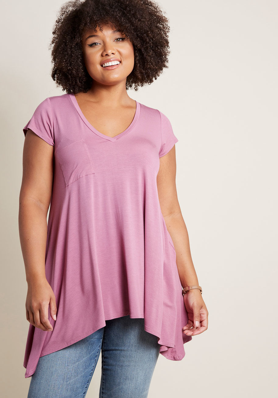 MCT1064 - If laid-back looks make you bat your lashes, then this loose T-shirt will send your heart aflutter! Opposite its V-neckline, this ModCloth-exclusive tunic hides a hint of sweet style, while its shark tail hem and versatile, deep purple hue offer a rad way